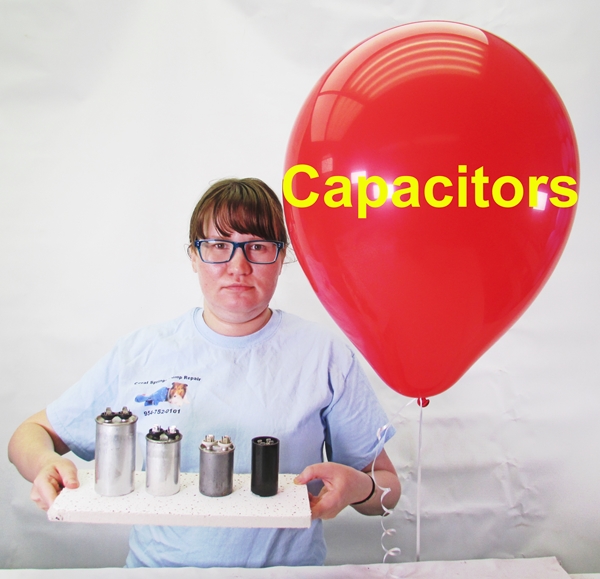 pretty girl with blue glasses and red balloon holding capacitors